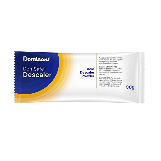 Dominant DomSafe Descaler powder packet on a white background