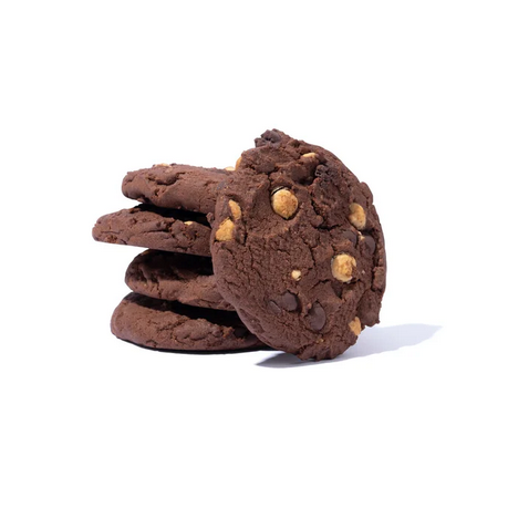 Stack of chocolate cookies with chocolate chips on a white background