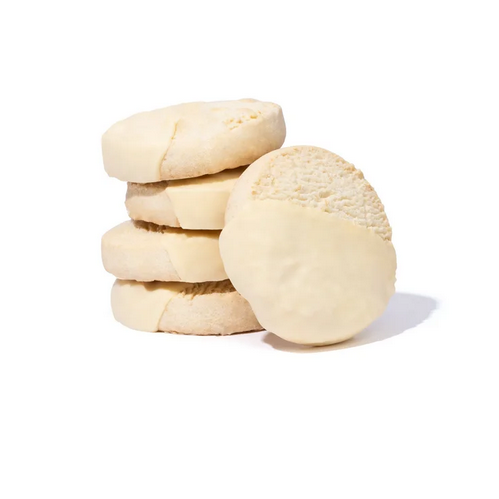 Stack of round, light-colored cookies on a white background
